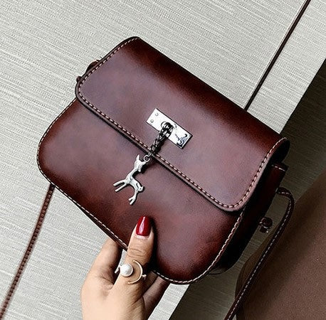 Elegant Crossbody Bag with Deer Pendant