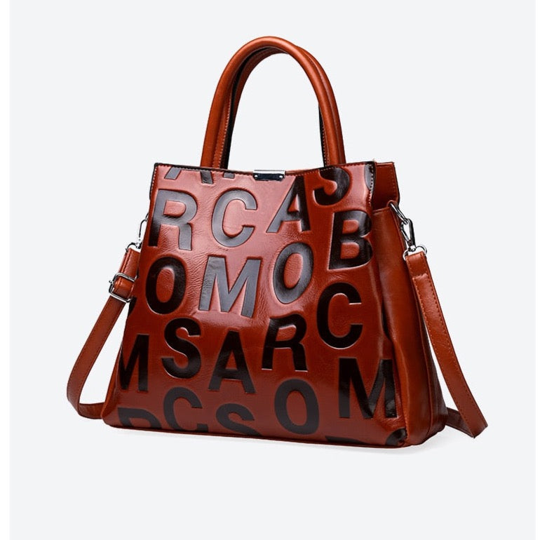 Kayla Letter Embossed Trapeze Bag - 4 Colors