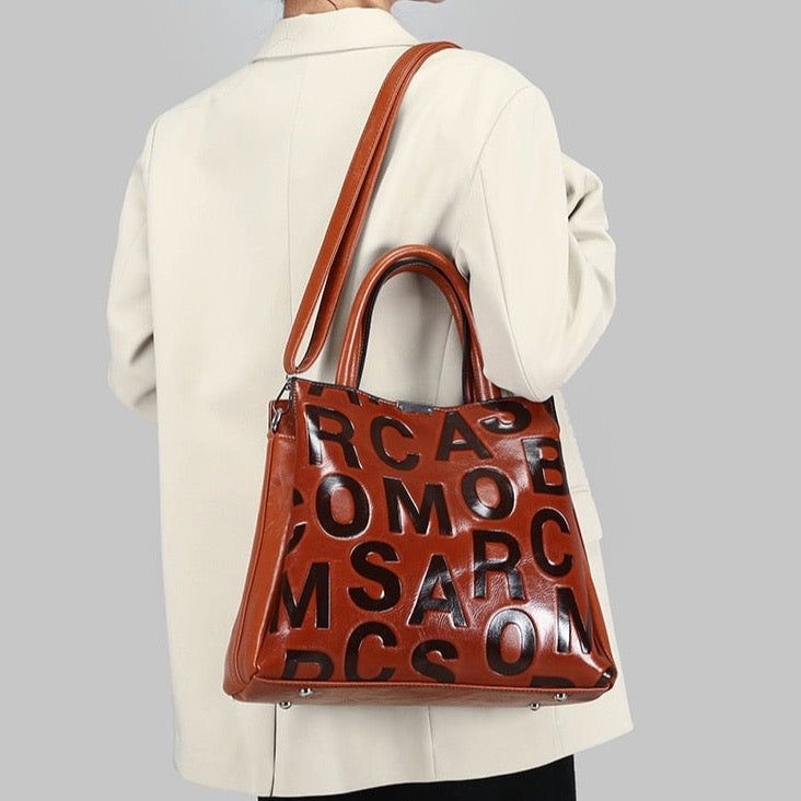 Kayla Letter Embossed Trapeze Bag - 4 Colors