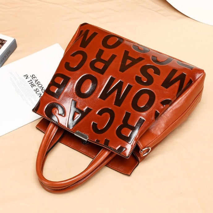 Kayla Letter Embossed Trapeze Bag - 4 Colors