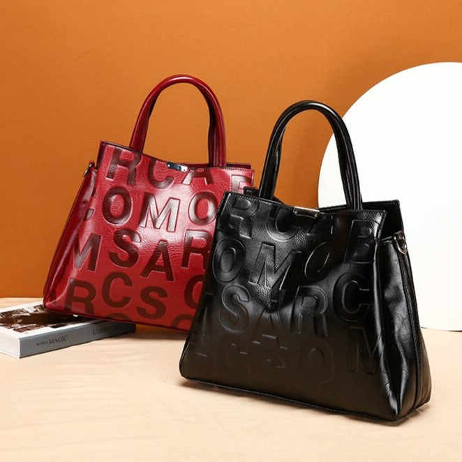 Kayla Letter Embossed Trapeze Bag - 4 Colors