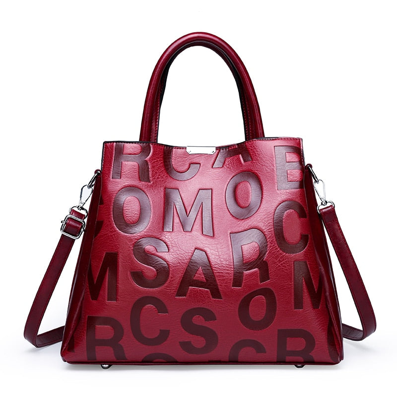 Kayla Letter Embossed Trapeze Bag - 4 Colors